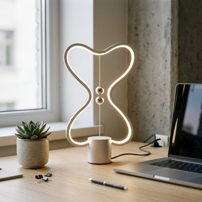Lumiqia floating balance LED night lamp glowing on nightstand