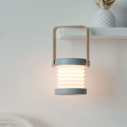 Lumiqia foldable touch dimmable lantern lamp glowing on bedside table