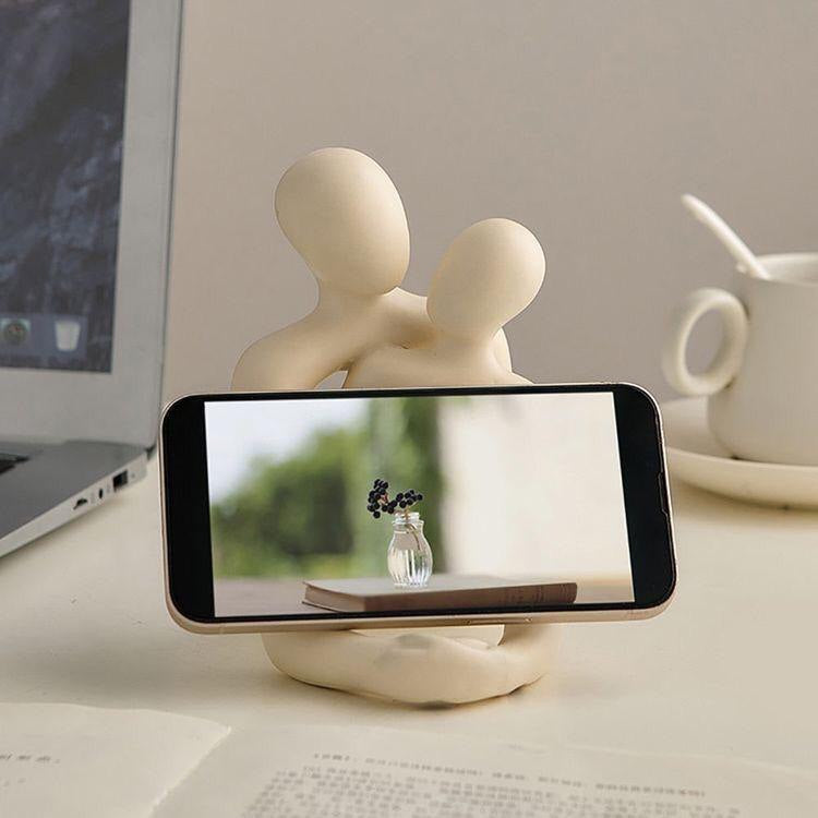 Lumiqia loving couple resin statue in milky white finish on shelf