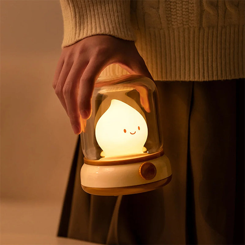 Lumiqia retro oil lamp style LED night light glowing on bedside table