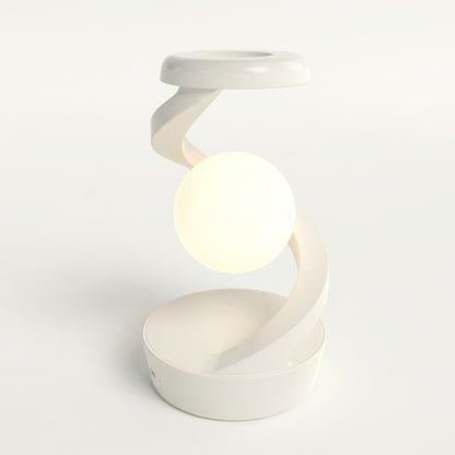 Lumiqia rotating moon lamp with wireless phone charger on nightstand