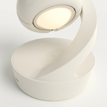 Lumiqia rotating moon lamp with wireless phone charger on nightstand