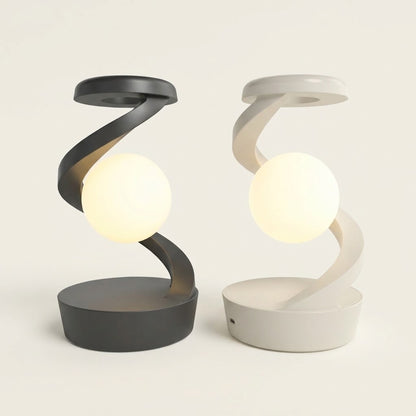 Lumiqia rotating moon lamp with wireless phone charger on nightstand