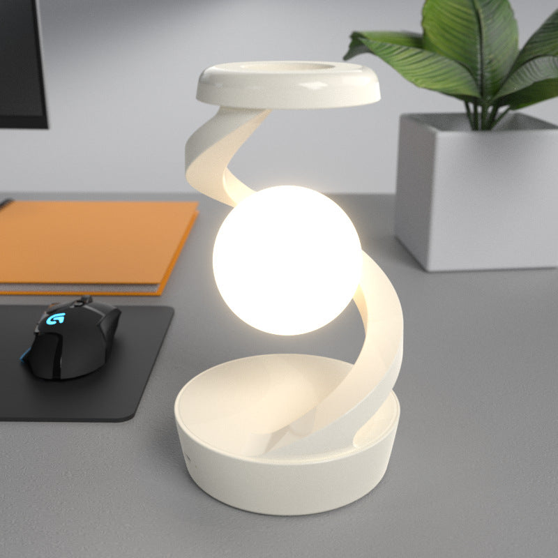 Lumiqia rotating moon lamp with wireless phone charger on nightstand