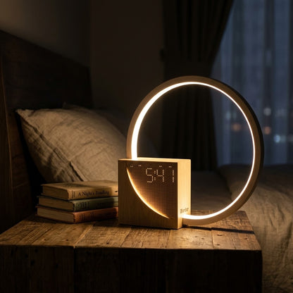 Lumiqia touch bedside lamp with alarm clock and natural sounds glowing on nightstand