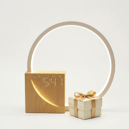 Lumiqia touch bedside lamp with alarm clock and natural sounds glowing on nightstand